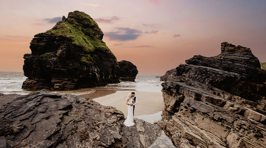 A stunning bride and groom sharing their first wedding , captured by a professional wedding photographer in Limerick. Sunset wedding in Ballybunion